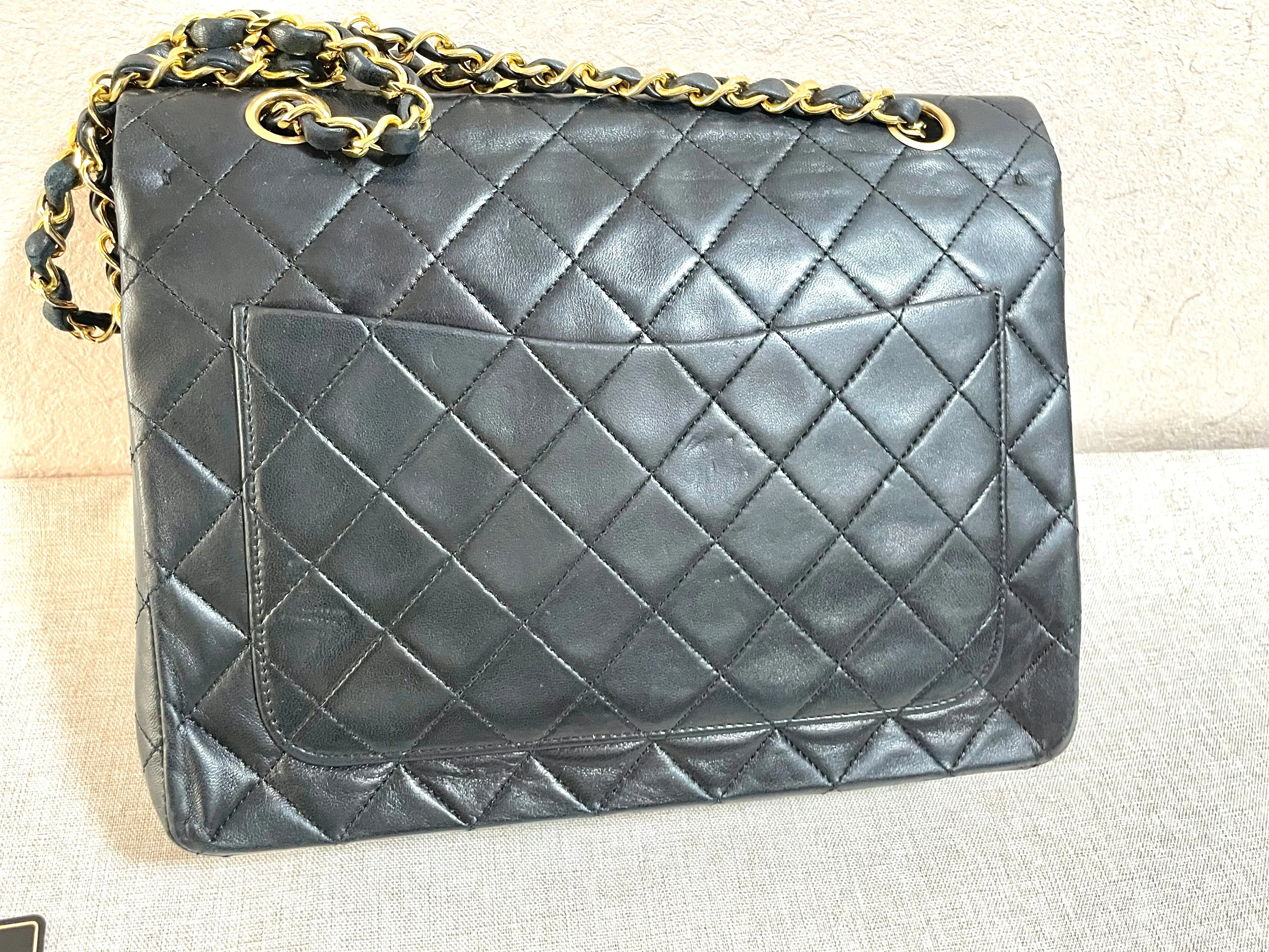 Vintage CHANEL black lambskin classic 2.55 double flap shoulder purse with golden chain straps. Make you even more chic. 061203ac1